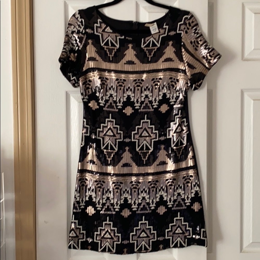 Dress with metallic color sequins